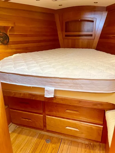 Tangaroa Yacht Photos Pics Cozy wooden cabin interior with bed, Tartan 4000, 2015 model.