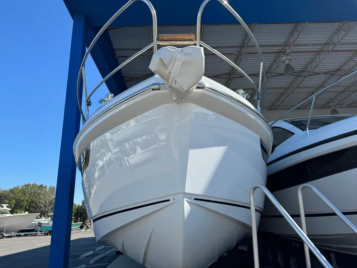  Yacht Photos Pics 2024 Sealine S335V boat in a showroom, viewed from the front.