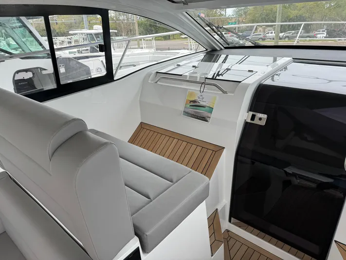 Yacht Photos Pics 2024 Sealine S335V yacht interior with sleek seating and modern design.