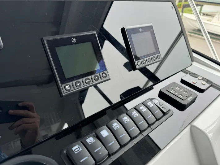  Yacht Photos Pics Control panel of 2024 Sealine S335V boat with digital displays and buttons.