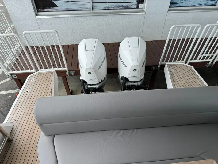  Yacht Photos Pics 2024 Sealine S335V boat with twin outboard engines, rear view.