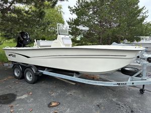 2023 Mako SKIFF 19 CC boat on trailer, parked outdoors.