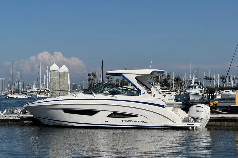 33 Xo Best Deals Of The Year!!1 Yacht Photos Pics 2026 Regal 33 XO boat docked in marina, clear sky, calm water.