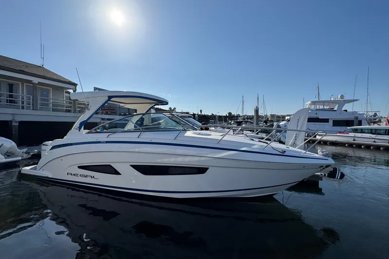 33 Xo Best Deals Of The Year!!1 Yacht Photos Pics 2026 Regal 33 XO boat docked at marina under clear sky.