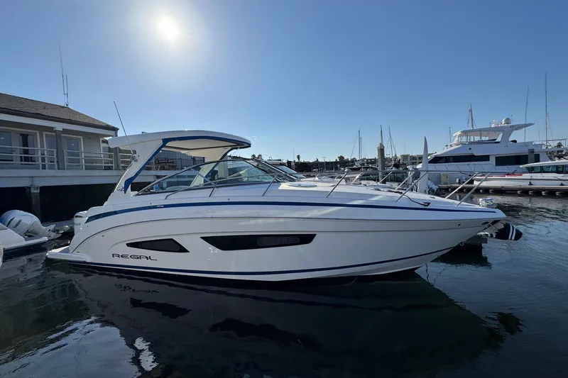 33 Xo Best Deals Of The Year!!1 Yacht Photos Pics 2026 Regal 33 XO boat docked at marina under clear sky.