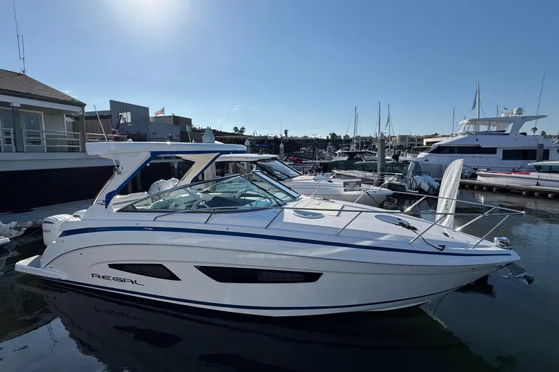 33 Xo Best Deals Of The Year!!1 Yacht Photos Pics 2026 Regal 33 XO boat docked at marina, sleek design, sunny day.