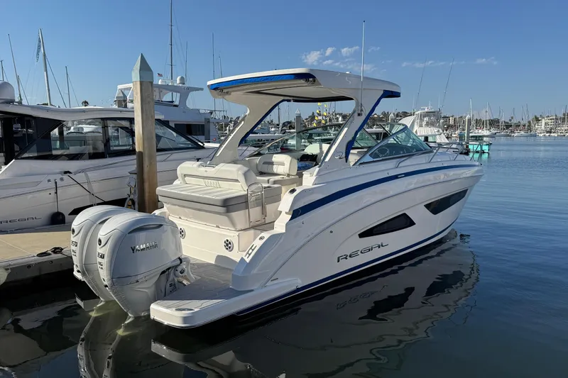 33 Xo Best Deals Of The Year!!1 Yacht Photos Pics 2026 Regal 33 XO boat docked in marina, featuring twin Yamaha outboard engines.