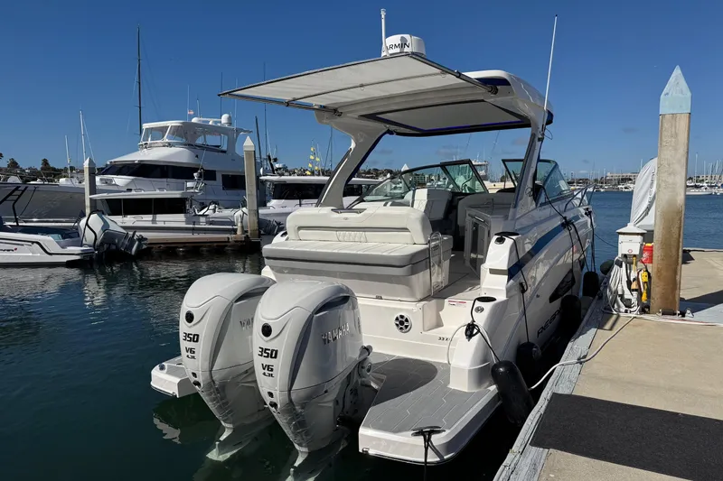 33 Xo Best Deals Of The Year!!1 Yacht Photos Pics 2026 Regal 33 XO boat docked with twin Yamaha 350 engines, sunny marina setting.