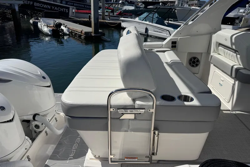 33 Xo Best Deals Of The Year!!1 Yacht Photos Pics 2026 Regal 33 XO yacht interior with seating and cup holders at a marina.