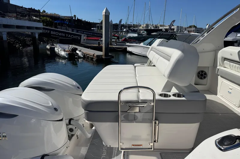 33 Xo Best Deals Of The Year!!1 Yacht Photos Pics 2026 Regal 33 XO boat with white seating and dual outboard engines at a marina.