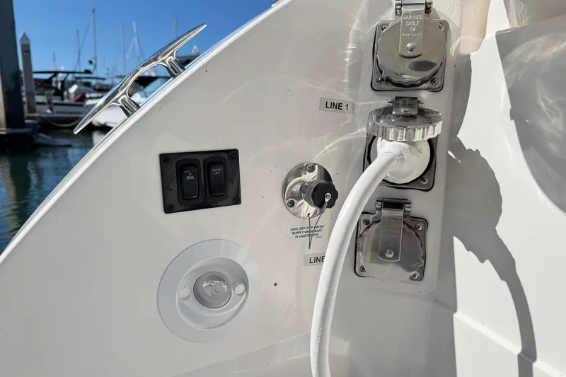33 Xo Best Deals Of The Year!!1 Yacht Photos Pics 2026 Regal 33 XO boat utility connections and controls at marina dock.