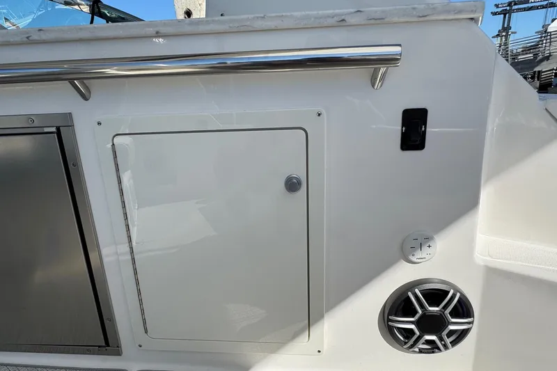 33 Xo Best Deals Of The Year!!1 Yacht Photos Pics 2026 Regal 33 XO boat interior with storage compartment and speaker.