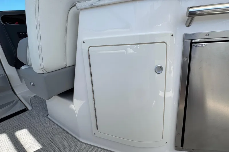 33 Xo Best Deals Of The Year!!1 Yacht Photos Pics 2026 Regal 33 XO boat interior with white seating and stainless steel compartment.