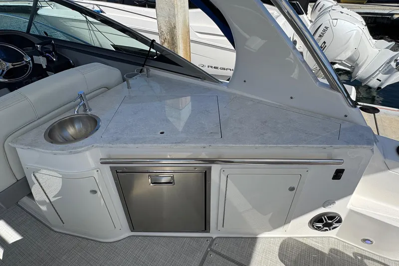 33 Xo Best Deals Of The Year!!1 Yacht Photos Pics 2026 Regal 33 XO boat interior with sink, countertop, and storage.