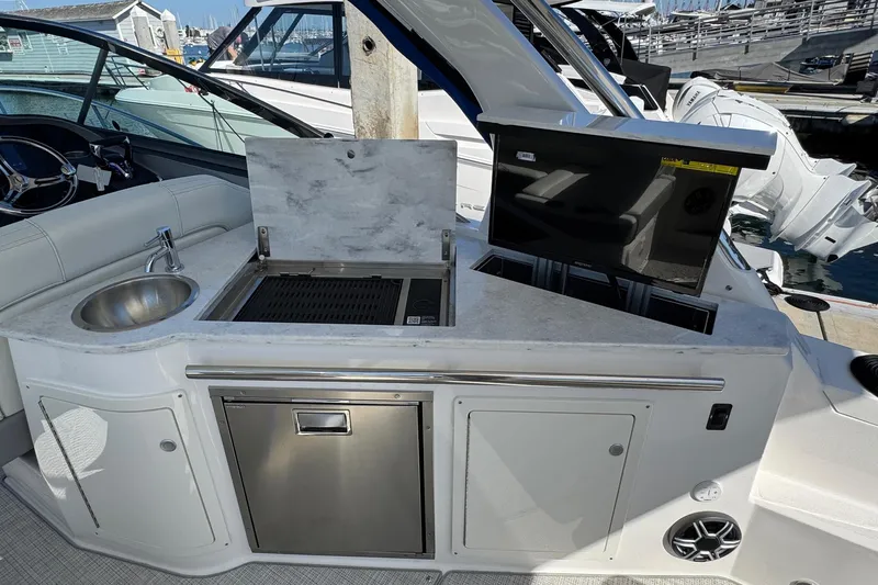 33 Xo Best Deals Of The Year!!1 Yacht Photos Pics 2026 Regal 33 XO yacht kitchenette with sink, grill, and storage at marina.