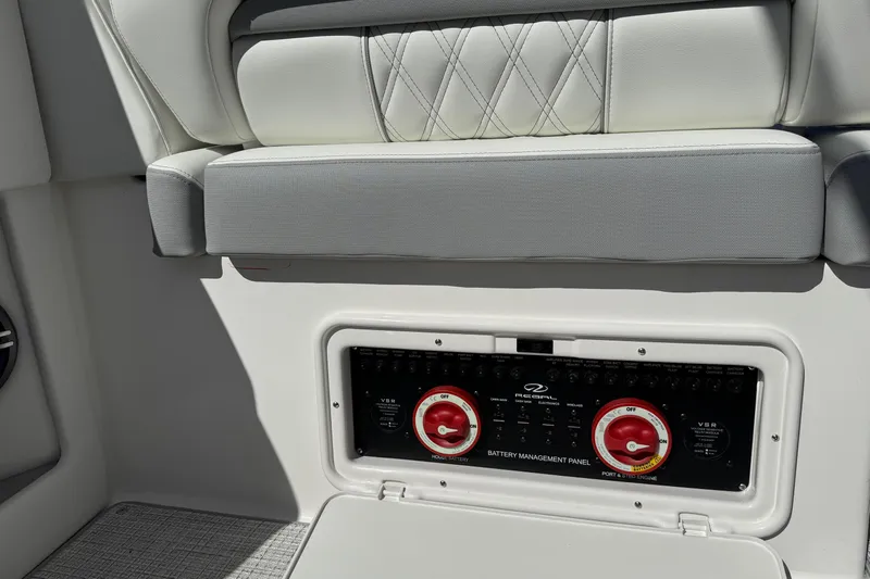 33 Xo Best Deals Of The Year!!1 Yacht Photos Pics 2026 Regal 33 XO boat battery management panel with cushioned seating above.