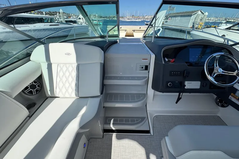 33 Xo Best Deals Of The Year!!1 Yacht Photos Pics 2026 Regal 33 XO boat interior with modern helm and seating at marina.