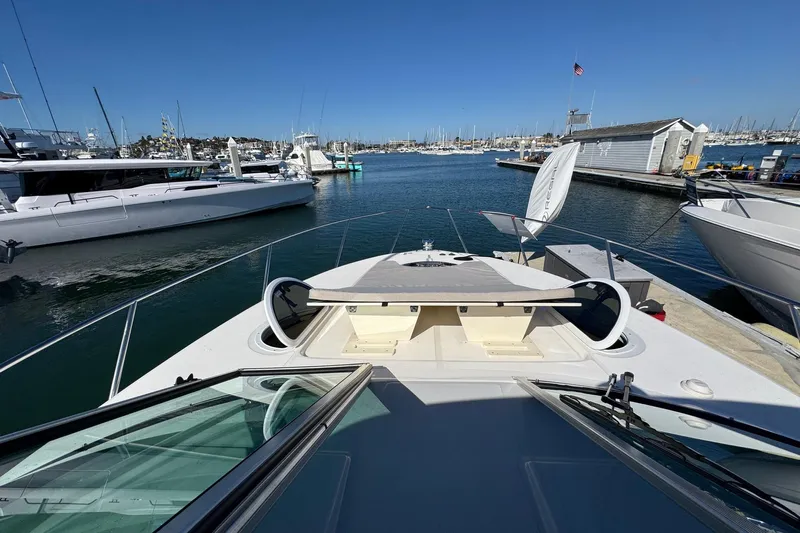 33 Xo Best Deals Of The Year!!1 Yacht Photos Pics 2026 Regal 33 XO yacht docked at marina, clear sky, calm waters.