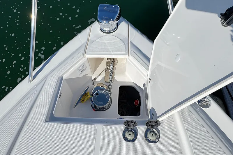 33 Xo Best Deals Of The Year!!1 Yacht Photos Pics 2026 Regal 33 XO boat anchor compartment with chain and winch, open hatch view.