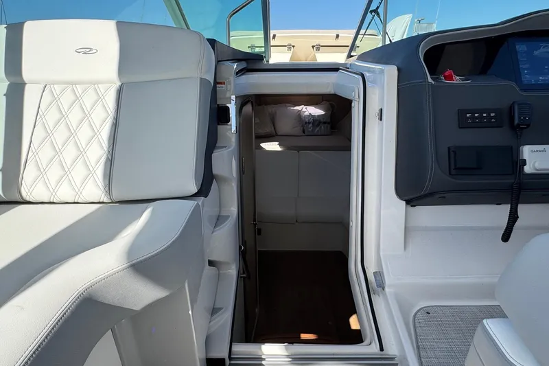 33 Xo Best Deals Of The Year!!1 Yacht Photos Pics 2026 Regal 33 XO boat interior with luxurious seating and cabin entrance.