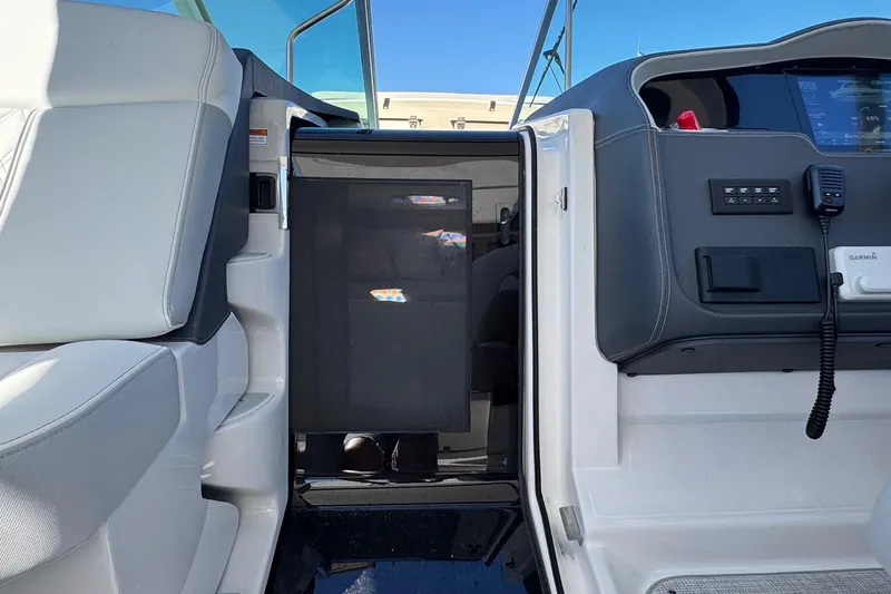 33 Xo Best Deals Of The Year!!1 Yacht Photos Pics Interior view of 2026 Regal 33 XO boat cockpit with modern controls and seating.