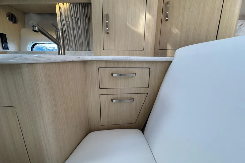 33 Xo Best Deals Of The Year!!1 Yacht Photos Pics Interior of 2026 Regal 33 XO yacht with modern cabinetry and seating.