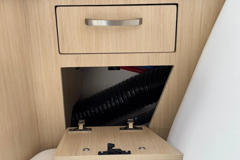 33 Xo Best Deals Of The Year!!1 Yacht Photos Pics 2026 Regal 33 XO interior storage compartment with open hatch and visible wiring.