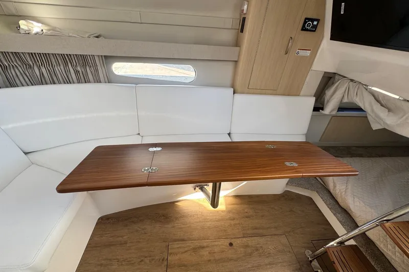 33 Xo Best Deals Of The Year!!1 Yacht Photos Pics Interior of 2026 Regal 33 XO yacht with wooden table and white seating.