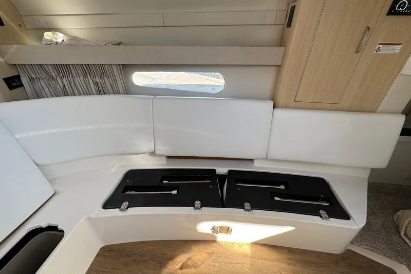 33 Xo Best Deals Of The Year!!1 Yacht Photos Pics Interior of 2026 Regal 33 XO boat with white seating and storage compartments.