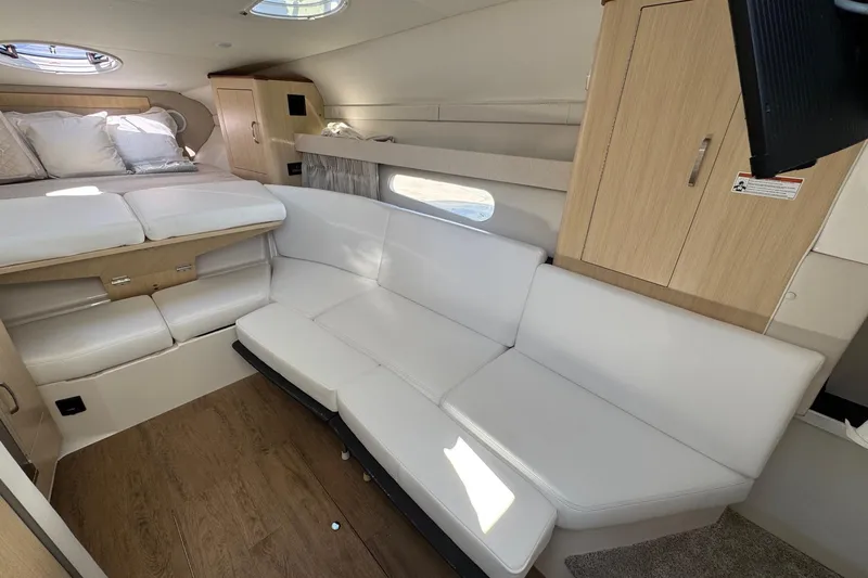 33 Xo Best Deals Of The Year!!1 Yacht Photos Pics Luxurious interior of 2026 Regal 33 XO yacht with white seating and wood accents.