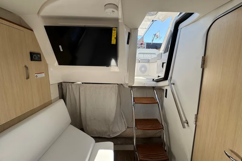 33 Xo Best Deals Of The Year!!1 Yacht Photos Pics Interior of 2026 Regal 33 XO boat with modern seating and wooden steps.