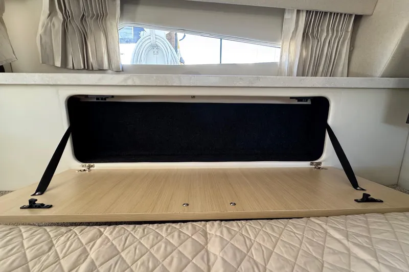 33 Xo Best Deals Of The Year!!1 Yacht Photos Pics Open storage compartment in 2026 Regal 33 XO boat interior.