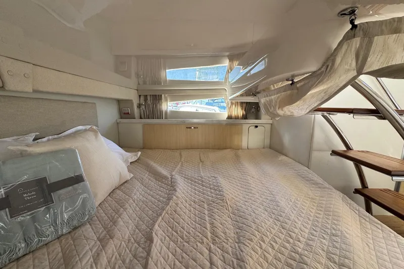 33 Xo Best Deals Of The Year!!1 Yacht Photos Pics Interior cabin of 2026 Regal 33 XO yacht with cozy bed and natural light.