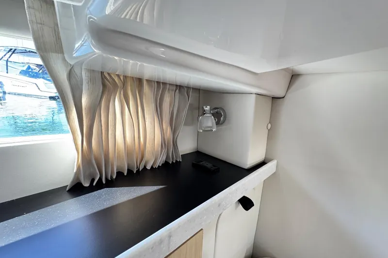 33 Xo Best Deals Of The Year!!1 Yacht Photos Pics Interior of 2026 Regal 33 XO yacht with elegant curtains and sleek countertop design.