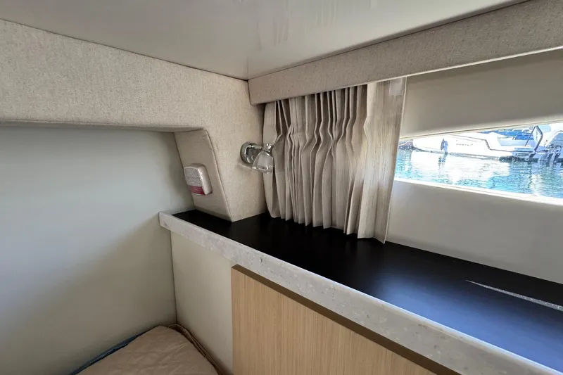 33 Xo Best Deals Of The Year!!1 Yacht Photos Pics Interior of 2026 Regal 33 XO yacht with window view and elegant curtains.