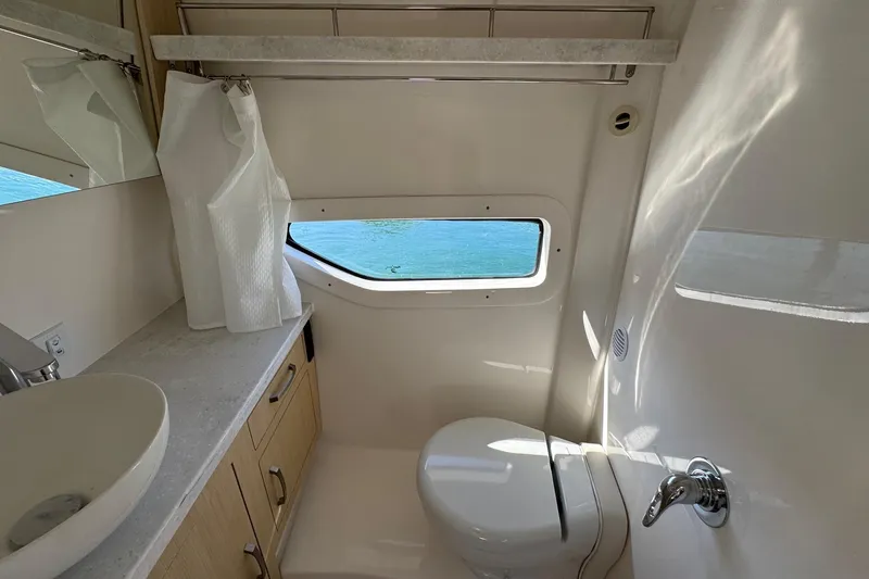 33 Xo Best Deals Of The Year!!1 Yacht Photos Pics Luxurious bathroom in 2026 Regal 33 XO yacht with ocean view window.