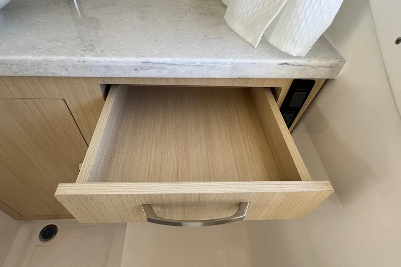 33 Xo Best Deals Of The Year!!1 Yacht Photos Pics Open wooden drawer in 2026 Regal 33 XO boat interior.