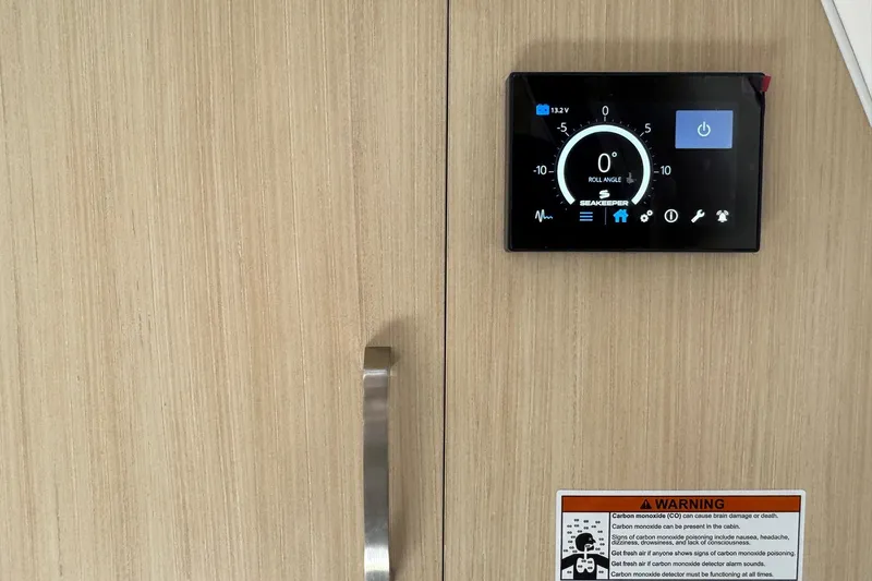 33 Xo Best Deals Of The Year!!1 Yacht Photos Pics Control panel and warning label on 2026 Regal 33 XO boat interior.