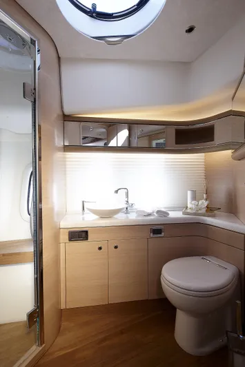 Double Down Yacht Photos Pics Luxurious bathroom in 2018 Zeelander Z55 yacht, featuring modern fixtures and elegant wood finishes.