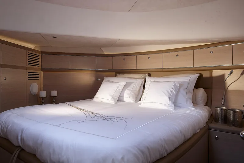 Double Down Yacht Photos Pics Luxurious cabin interior of 2018 Zeelander Z55 yacht with elegant bedding and ambient lighting.