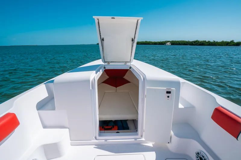  Yacht Photos Pics 2007 Donzi 38 ZF Cuddy boat interior with open hatch, on calm blue water.