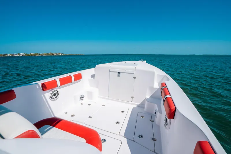  Yacht Photos Pics 2007 Donzi 38 ZF Cuddy boat with red and white interior on open water.