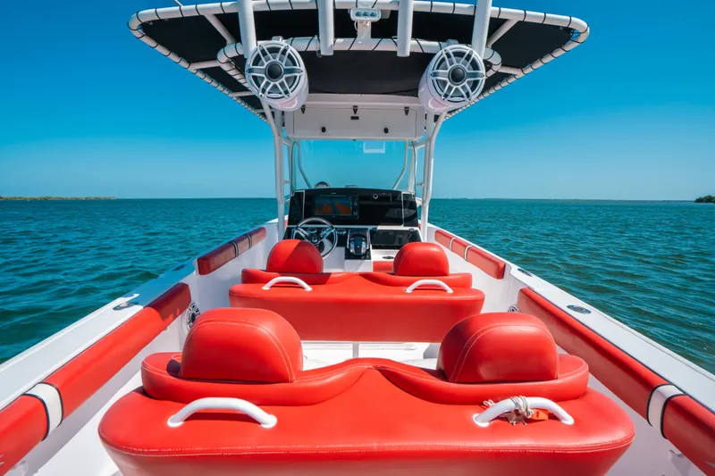  Yacht Photos Pics 2007 Donzi 38 ZF Cuddy boat with red seating on open water.