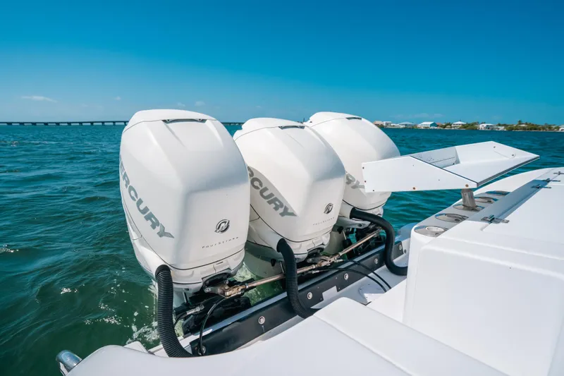  Yacht Photos Pics 2007 Donzi 38 ZF Cuddy with triple Mercury outboard engines on open water.