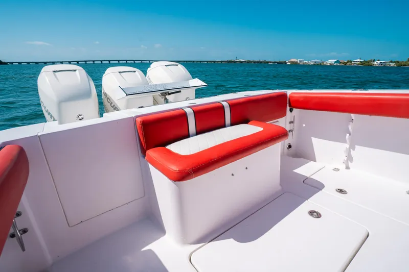  Yacht Photos Pics 2007 Donzi 38 ZF Cuddy boat interior with red seating, ocean view.