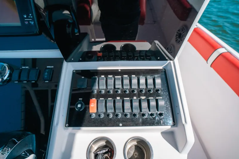  Yacht Photos Pics Control panel of a 2007 Donzi 38 ZF Cuddy boat with switches and gauges.