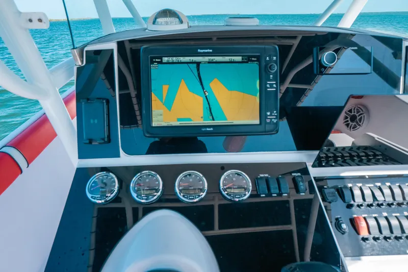  Yacht Photos Pics Dashboard of a 2007 Donzi 38 ZF Cuddy boat with navigation system and gauges.