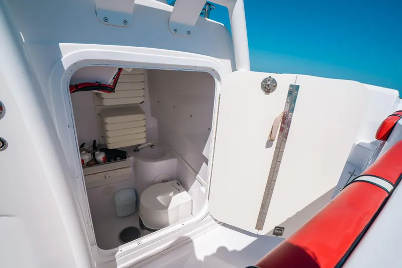  Yacht Photos Pics 2007 Donzi 38 ZF Cuddy boat interior with open storage compartment.