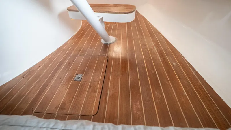  Yacht Photos Pics Teak flooring on 2015 Intrepid 400 Cuddy boat interior, showcasing elegant wood finish.