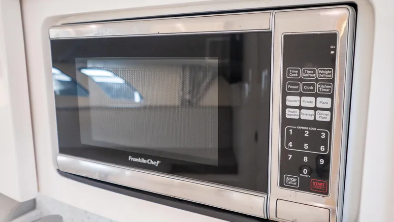 Yacht Photos Pics Microwave oven inside 2015 Intrepid 400 Cuddy boat kitchen area.